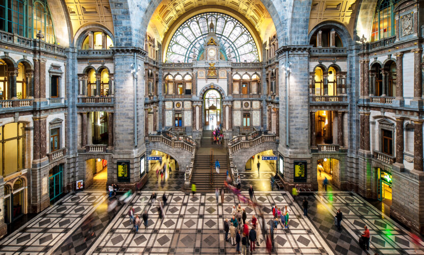 Grand hall of Antwerp Central Station with its ornate vaulted ceiling